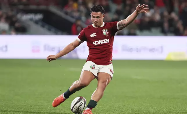 Marcus Smith of the British &amp; Irish Lions takes a shot at goal during the rugby match between the Lions and the AUNZ Invitational XV in Adelaide, Saturday, July 12, 2025. (AP Photo/James Elsby)