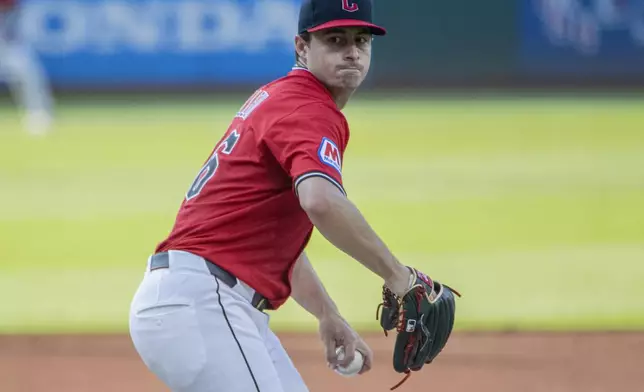 Cleveland Guardians starting pitcher Logan Allen delivers against the Colorado Rockies during the first inning of a baseball game, Tuesday, July 29, 2025, in Cleveland. (AP Photo/Phil Long)
