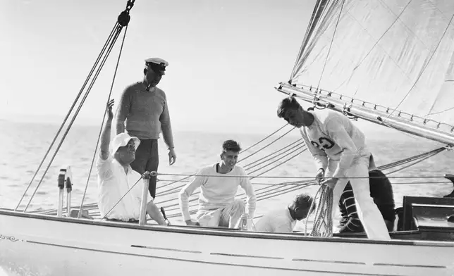FILE - The 45-foot schooner Amberjack, with President Franklin D. Roosevelt aboard, seated and wearing sailor's hat, is shown sailing from Buzzard's Bay, Mass., toward Campobello Island, off the coast of Maine, during his vacation, June 1933. Crew members are unidentified. (AP Photo, File)
