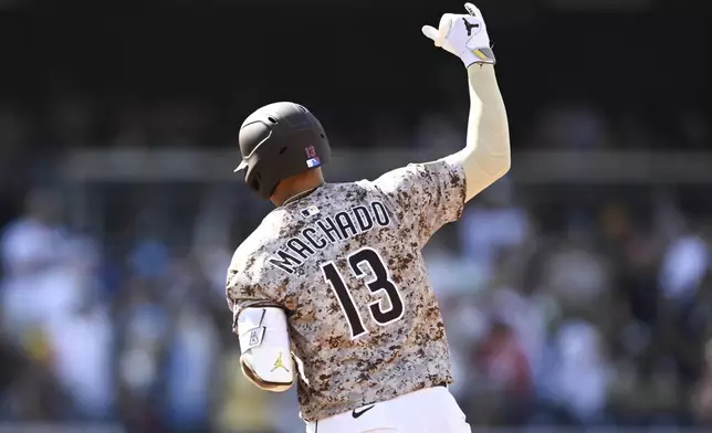 San Diego Padres' Manny Machado rounds the bases after hitting a solo home run during the fourth inning of a baseball game against the Texas Rangers, Friday, July 4, 2025. (AP Photo/Denis Poroy)