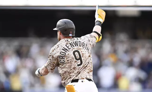 San Diego Padres' Jake Cronenworth celebrates after hitting a walkoff single during the 10th inning of a baseball game against the Texas Rangers, Friday, July 4, 2025. (AP Photo/Denis Poroy)