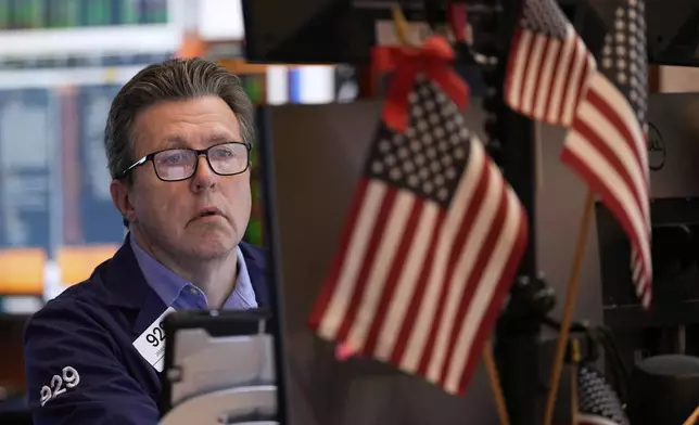 James Matthews works on the floor at the New York Stock Exchange in New York, Wednesday, July 16, 2025. (AP Photo/Seth Wenig)