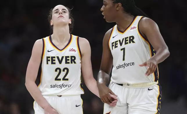 Indiana Fever's Caitlin Clark (22) reacts with a possible injury beside Aliyah Boston (7) during the second half of a WNBA basketball game against the Connecticut Sun, Tuesday, July 15, 2025, in Boston. (AP Photo/Michael Dwyer)