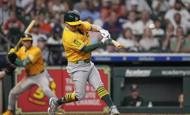 Athletics' Luis Urías hits home run against the Houston Astros during the sixth inning of a baseball game Thursday, July 24, 2025, in Houston. (AP Photo/David J. Phillip)