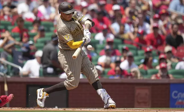 San Diego Padres' Manny Machado doubles during the first inning of a baseball game against the St. Louis Cardinals Sunday, July 27, 2025, in St. Louis. (AP Photo/Jeff Roberson)