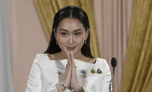 FILE - Thailand's new Prime Minister Paetongtarn Shinawatra talks to media members after receiving a royal letter of endorsement for the post at the Pheu Thai party headquarters in Bangkok, Thailand, on Aug. 18, 2024. (AP Photo/Sakchai Lalit, File)