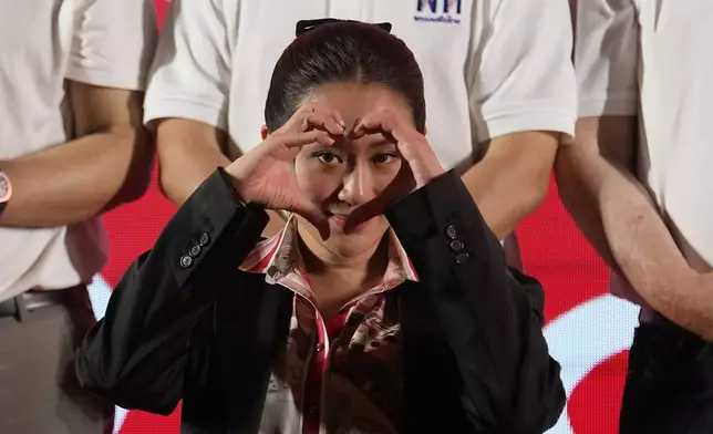 FILE - Paetongtarn Shinawatra, one of the opposition Pheu Thai party's top politicians and youngest daughter of exiled former deposed Thai leader Thaksin Shinawatra, gestures to supporters during a general election campaign in Bangkok, Thailand, on March 24, 2023. (AP Photo/Sakchai Lalit, File)