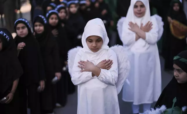Shiite faithful Muslims attend an Ashoura procession to mark the tenth day of the Muharram month, in Istanbul, Turkey, Saturday, July 5, 2025. (AP Photo/Francisco Seco)