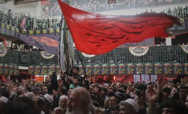 Afghan Shia attend a sermon marking Ashoura, the Shiite Muslim commemoration of the 7th-century death of Imam Hussein, the grandson of the Prophet Muhammad, at the Chendawol Mosque in Kabul, Afghanistan, Sunday, July 6, 2025. (AP Photo/Siddiqullah Alizai)