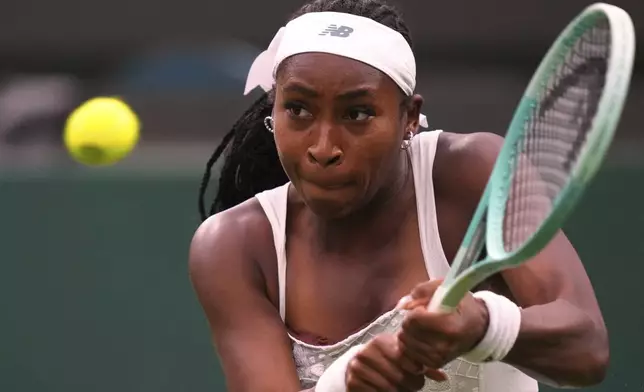Coco Gauff of the U.S. returns the ball to Dayana Yastremska of Ukraine during their first round women's single match at the Wimbledon Tennis Championships in London, Tuesday, July 1, 2025.(AP Photo/Kirsty Wigglesworth)
