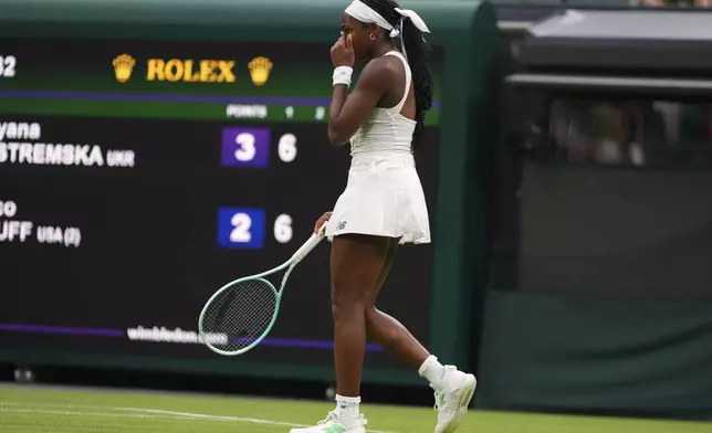 Coco Gauff of the U.S. reacts during her first round women's single match against Dayana Yastremska of Ukraine at the Wimbledon Tennis Championships in London, Tuesday, July 1, 2025.(AP Photo/Kirsty Wigglesworth)