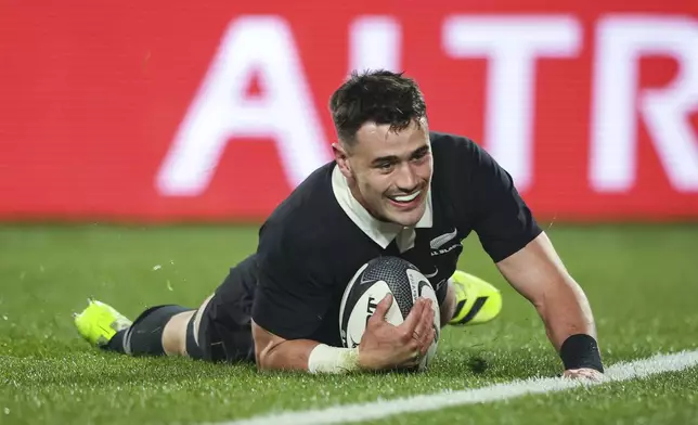 New Zealand's Will Jordan scores a try against France during their rugby union test match in Hamilton, New Zealand on Saturday, July 19, 2025. (Brett Phibbs/Photosport via AP)