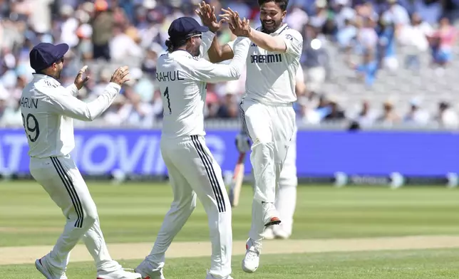 Indian players celebrate the dismissal of England's Ben Duckett during the third cricket test match between England and India at Lord's cricket ground in London, Thursday, July 10, 2025. (AP Photo/Richard Pelham)