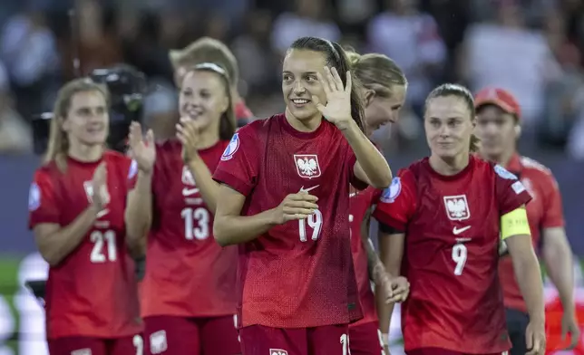 Poland's Natalia Padilla-Bidas, (19) and teammates react after the the Women's Euro 2025, group C, soccer match between Poland and Denmark at Allmend Stadion Luzern in Lucerne, Switzerland, Saturday, July 12, 2025. (Urs Flueeler/Keystone via AP)