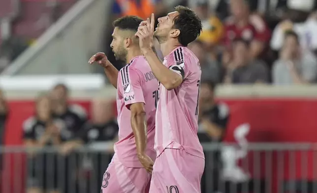 Inter Miami's Lionel Messi, right, gestures after scoring a goal as Jordi Alba walks away during the second half of an MLS soccer match against the New York Red Bulls Saturday, July 19, 2025, in Harrison, N.J. (AP Photo/Frank Franklin II)