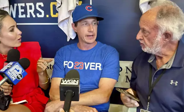 Chicago Cubs manager Craig Counsell speaks to reporters while wearing a T-shirt honoring Hall of Fame Ryne Sandberg on Tuesday in Milwaukee. (AP Photo/Steve Megargee)