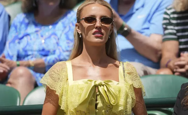 Morgan Riddle, the girlfriend of Taylor Fritz, arrives to watch the men's singles quarter final match between Taylor Fritz of the U.S. and Karen Khachanov of Russia at the Wimbledon Tennis Championships in London, Tuesday, July 8, 2025.(AP Photo/Kin Cheung)