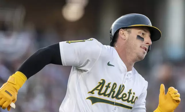 Athletics' Brent Rooker runs after hitting an RBI double during the second inning of a baseball game against the San Francisco Giants Friday, July 4, 2025, in West Sacramento, Calif. (AP Photo/Sara Nevis)