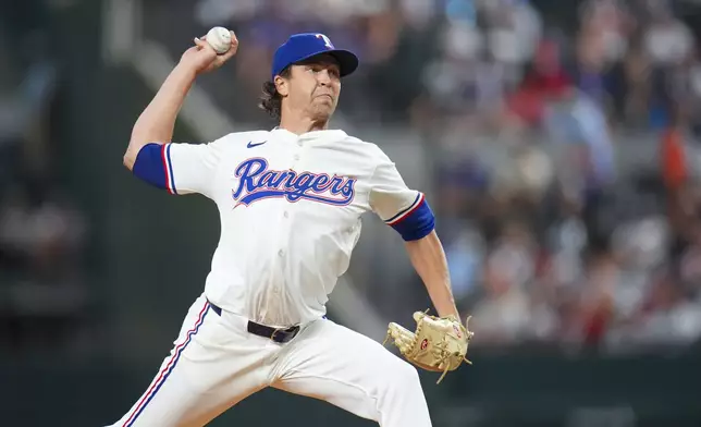 Texas Rangers pitcher Jacob deGrom throws a pitch to the Baltimore Orioles during the first inning of a baseball game Tuesday, July 1, 2025, in Arlington, Texas. (AP Photo/Julio Cortez)
