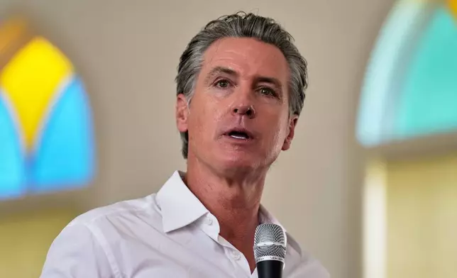 Gov. Gavin Newsom, D-Calif., gives remarks to a crowd at St. Paul First Baptist Church on Wednesday, July 9, 2025, in Laurens, S.C. (AP Photo/Meg Kinnard)