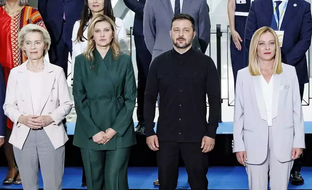 Front row from left, European Commission President Ursula von der Leyen, Olena Zelenska, Ukrainian President Volodymyr Zelenskyy and Italian Premier Giorgia Meloni pose for a family photo on the occasion of the Ukraine Recovery Conference at La Nuvola convention center in Rome, Thursday, July 10, 2025. (Mauro Scrobogna/LaPresse via AP)