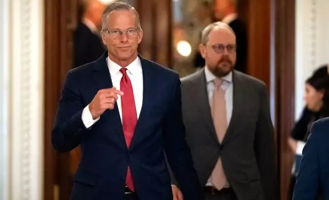Senate Majority Leader John Thune, of S.D., walks toward his office from the Senate chamber at the Capitol, Wednesday, July 16, 2025, in Washington. (AP Photo/Mark Schiefelbein)