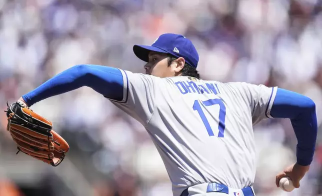 Los Angeles Dodgers' Shohei Ohtani pitches to a San Francisco Giants batter during the third inning of a baseball game Saturday, July 12, 2025, in San Francisco. (AP Photo/Godofredo A. Vásquez)