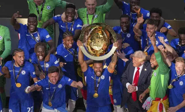 Chelsea pleayers celebrate with the championship trophy after the Club World Cup final soccer match between Chelsea and PSG in East Rutherford, N.J., Sunday, July 13, 2025. (AP Photo/Matt Slocum)