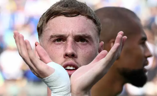 Chelsea's Cole Palmer gestures toward the crowd after Chelsea won against Paris St Germain in the Club World Cup final, at the MetLife Stadium in East Rutherford, N.J., Sunday, July 13, 2025. (Kevin Lamarque/Pool Photo via AP)