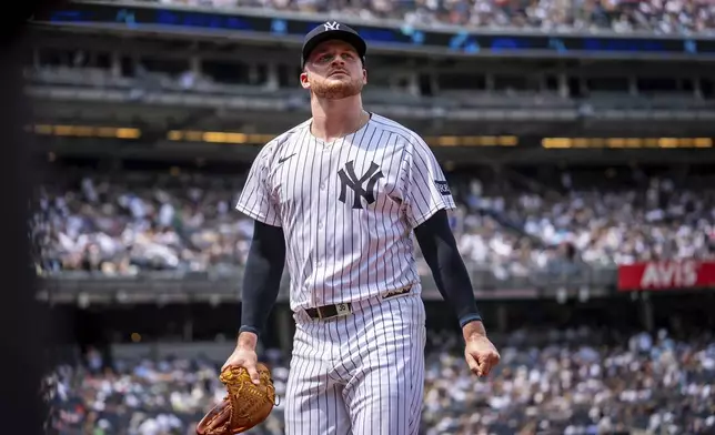 New York Yankees pitcher Clarke Schmidt (36) walks off the field during the fourth inning of a baseball game against the Athletics, Saturday, June 28, 2025, in New York. (AP Photo/Angelina Katsanis)
