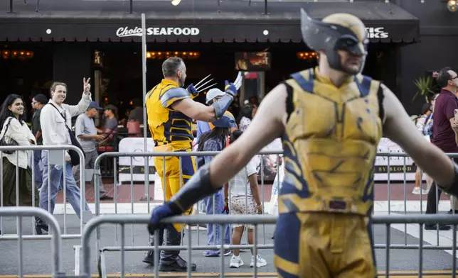 A person dressed as Wolverine from "X-Men" poses for a photograph during Comic-Con International on Thursday, July 24, 2025, in San Diego. (Photo by Andrew Park/Invision/AP)