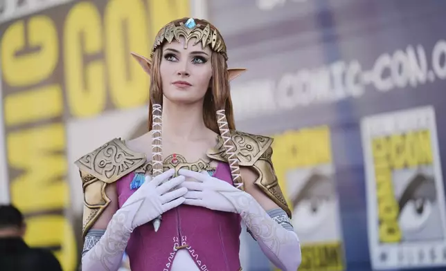 Allison Tabitha, of Orlando, Fla., dressed as Zelda from the "Legend of Zelda" video game, poses for photographers before the 2025 Comic-Con International Preview Night on Wednesday, July 23, 2025, in San Diego. (AP Photo/Chris Pizzello)