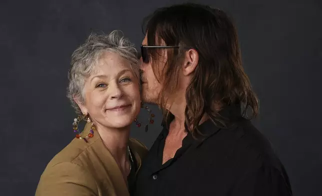Melissa McBride, left, and Norman Reedus pose for a portrait to promote "The Walking Dead: Daryl Dixon" during Comic-Con International on Friday, July 25, 2025, in San Diego. (AP Photo/Chris Pizzello)
