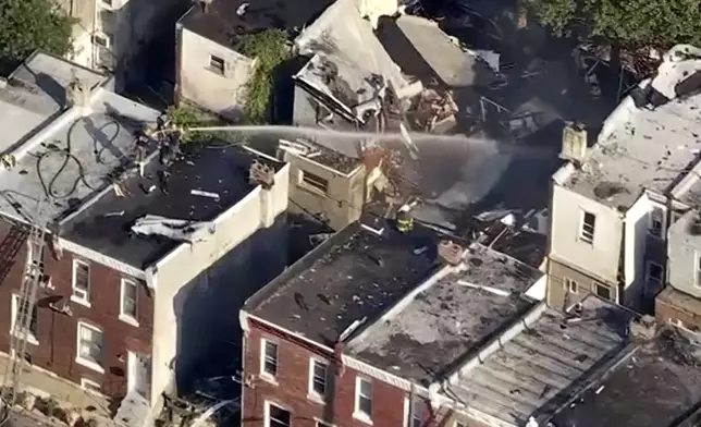This aerial video image provided by WPVI shows firefighters working on the aftermath of an explosion in Philadelphia, Sunday, June 29, 2025. (WPVI-TV via AP)