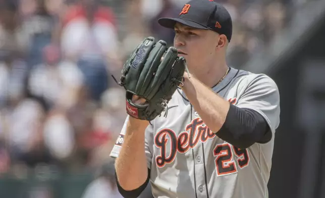 Detroit Tigers starter Tarik Skubal pauses before a pitch during the first inning of a baseball game against the Cleveland Guardians, Sunday, July 6, 2025, in Cleveland. (AP Photo/Phil Long)