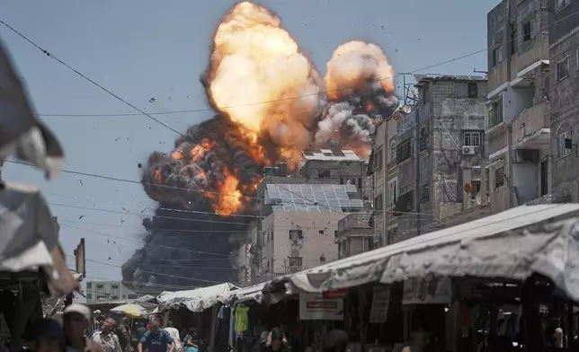 Thick smoke and flames erupt from an Israeli airstrike in Gaza City, Sunday, June 1, 2025. (AP Photo/Jehad Alshrafi)
