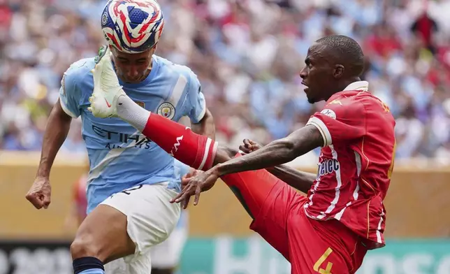 Wydad AC's Thembinkosi Lorch receives the ball in front of Manchester City's Vitor Reis during the Club World Cup group G soccer match in Philadelphia, Wednesday, June 18, 2025. (AP Photo/Derik Hamilton)