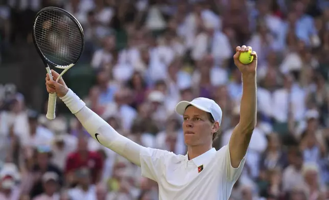 Italy's Jannik Sinner celebrates after beating Serbia's Novak Djokovic in a men's singles semifinal at the Wimbledon Tennis Championships in London, Friday, July 11, 2025. (AP Photo/Kin Cheung)