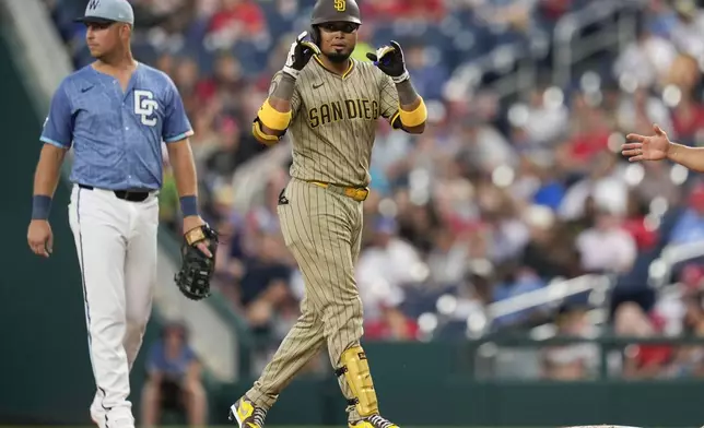San Diego Padres' Luis Arraez (4) gestures after hitting a single against the Washington Nationals during the third inning of a baseball game at Nationals Park, Friday, July 18, 2025, in Washington. (AP Photo/Jess Rapfogel)