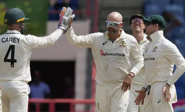 Australia's Nathan Lyon celebrates taking the wicket of West Indies' Justin Greaves during day two of the second cricket Test match at National Cricket Stadium in St. George's, Grenada, Friday, July 4, 2025. (AP Photo/Ricardo Mazalan)