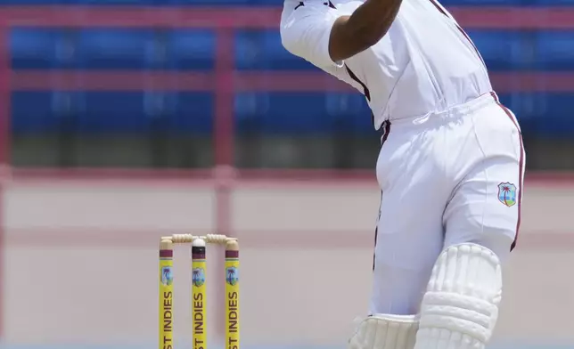 West Indies' captain Roston Chase plays a shot against Australia on day four of the second cricket Test match at the National Cricket Stadium in St. George's, Grenada, Sunday, July 6, 2025. (AP Photo/Ricardo Mazalan)