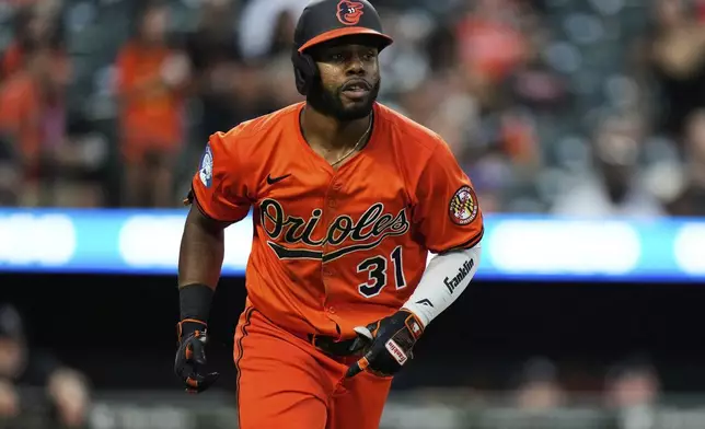 Baltimore Orioles' Cedric Mullins rounds the bases after hitting a three-run home run during the fourth inning of a baseball game against the Colorado Rockies, Saturday, July 26, 2025, in Baltimore. (AP Photo/Stephanie Scarbrough)