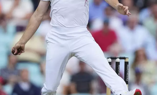 England's Chris Woakes bowls a delivery during the first day of the fifth cricket test match between England and India at The Kia Oval in London, Thursday, July 31, 2025. (AP Photo/Kirsty Wigglesworth)