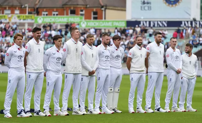 England team stand for the national anthem on the first day of the fifth cricket test match between England and India at The Kia Oval in London, Thursday, July 31, 2025. (AP Photo/Kirsty Wigglesworth)