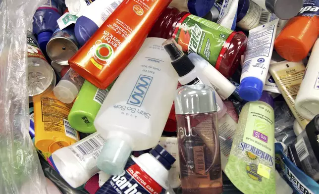 FILE- A bag full of various banned items collected from passengers' carry-on bags is displayed at the Portland International Jetport in Portland, Maine, Aug. 10, 2006. (AP Photo/Robert F. Bukaty, File)