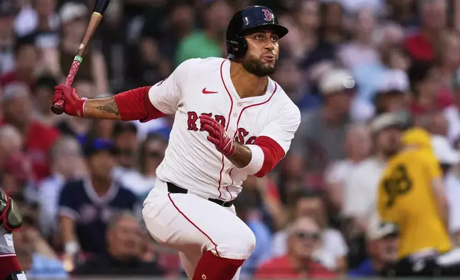 Boston Red Sox's Carlos Narvaez watches his RBI single during the first inning of a baseball game against the Cincinnati Reds at Fenway Park, Tuesday, July 1, 2025, in Boston. (AP Photo/Charles Krupa)