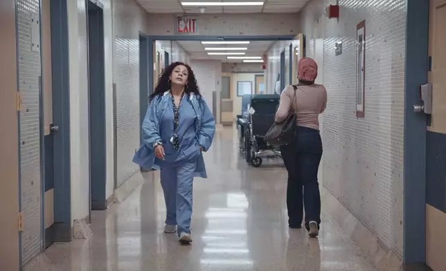 Medical staff walk through a hallway at Brookdale University Hospital and Medical Center on Tuesday, July 1, 2025, in the Brooklyn borough of New York. (AP Photo/Andres Kudacki)