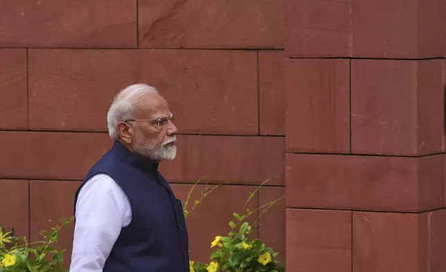Indian Prime Minister Narendra Modi arrives at the Parliament House on the opening day of monsoon session, in New Delhi, India, Monday, July 21, 2025. (AP Photo/Manish Swarup)