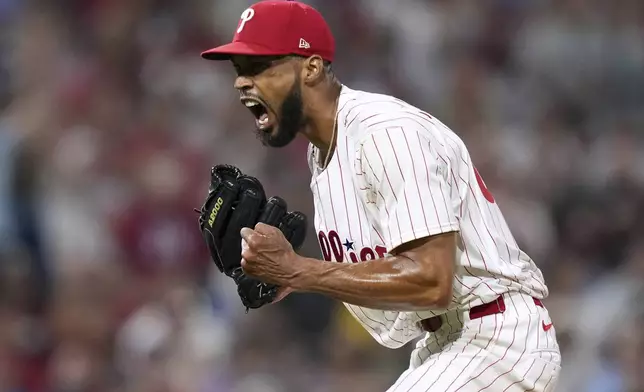 Philadelphia Phillies pitcher Cristopher Sánchez reacts after striking out Boston Red Sox's Rob Refsnyder during the eighth inning of a baseball game Tuesday, July 22, 2025, in Philadelphia. (AP Photo/Matt Slocum)