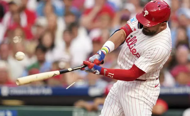 Philadelphia Phillies' Kyle Schwarber breaks his bat on a foul ball against Boston Red Sox pitcher Richard Fitts during the second base inning of a baseball game Tuesday, July 22, 2025, in Philadelphia. (AP Photo/Matt Slocum)